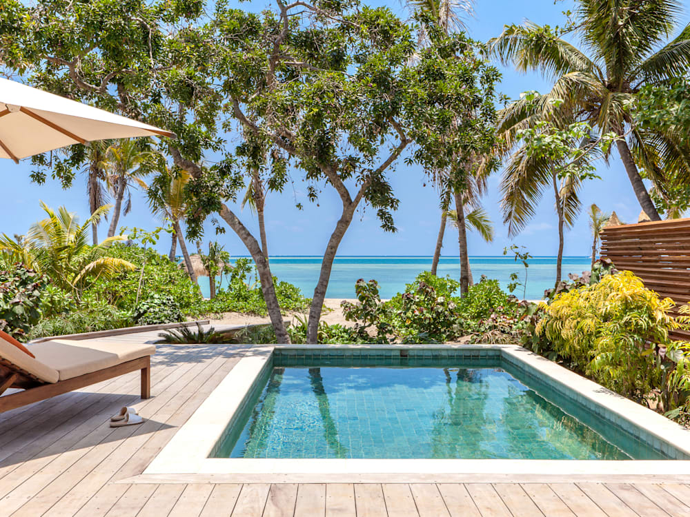 Swimming pool and deck looking out over the ocean