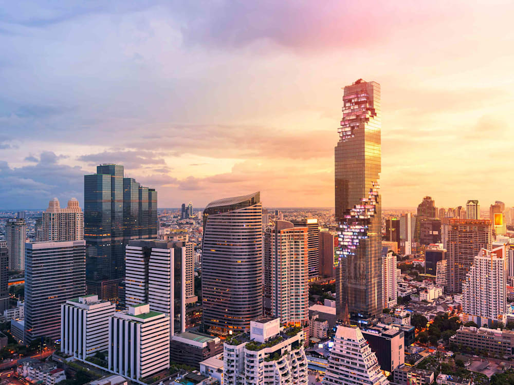 Hotel exterior at sunset in the skyline of Bangkok