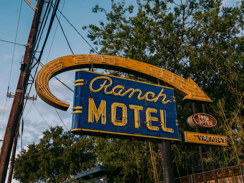 Retro signage for the Ranch Motel, by the side of the road.