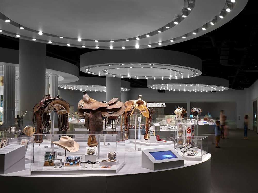 Exhibition displays at the Cowgirl Museum, including saddles and hats.