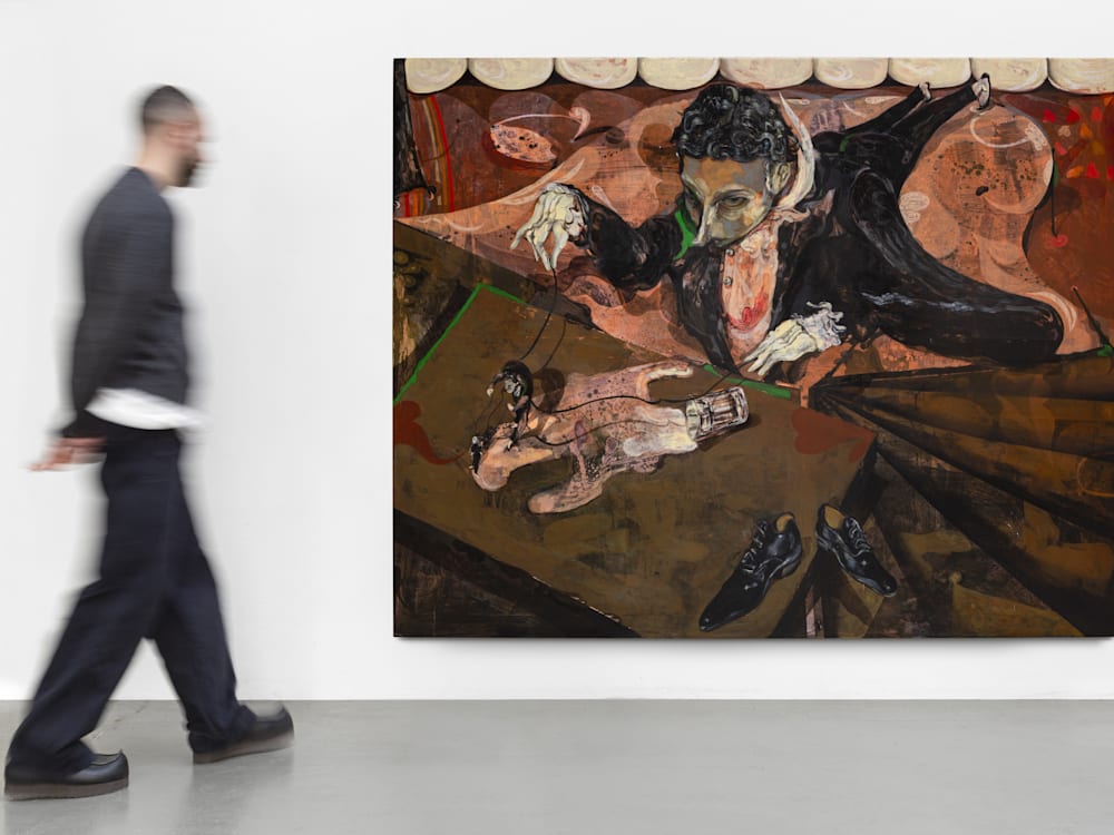 A man looks at a Guglielmo Castelli painting in an art gallery.