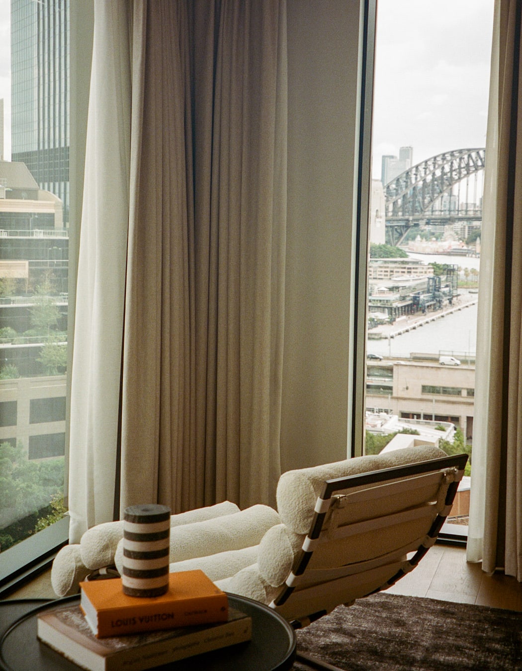 A curved chair with a view of Sydney